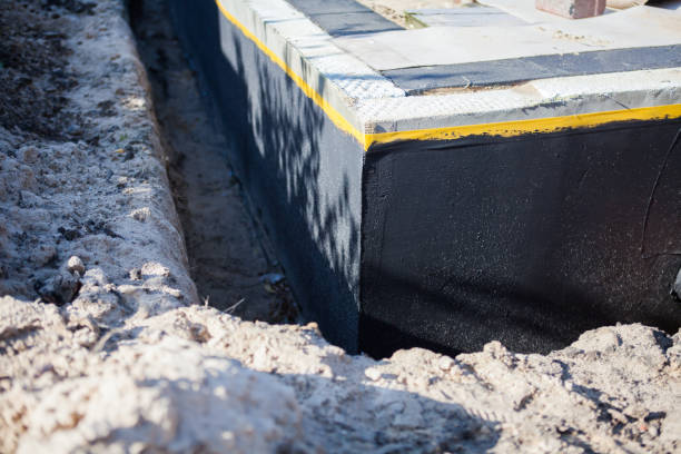 Professional Waterproofing technician working in Rush, NY